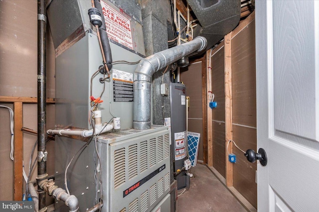 utility room featuring gas water heater