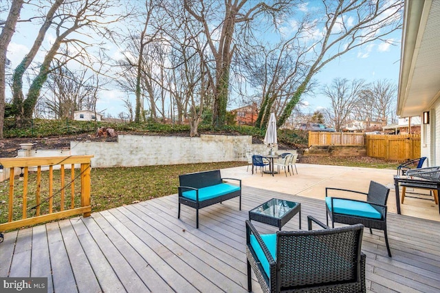 wooden terrace with fence, an outdoor living space, and outdoor dining space