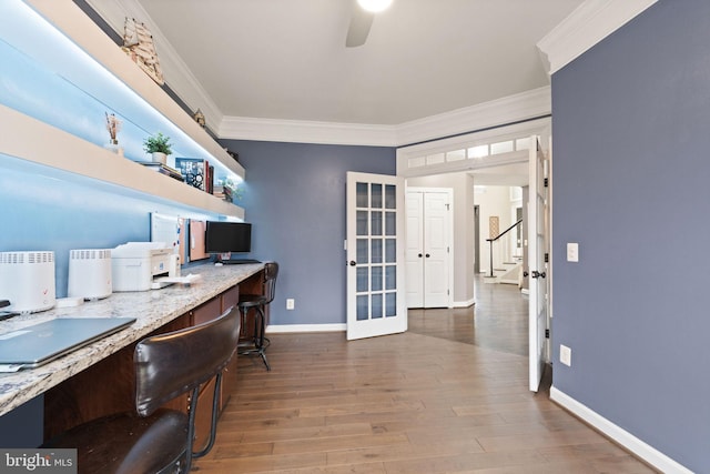 office featuring hardwood / wood-style flooring, crown molding, ceiling fan, and french doors