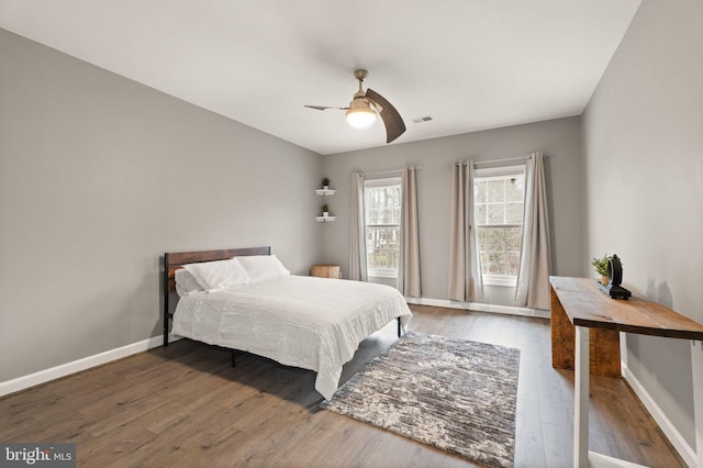 bedroom featuring ceiling fan and dark hardwood / wood-style flooring