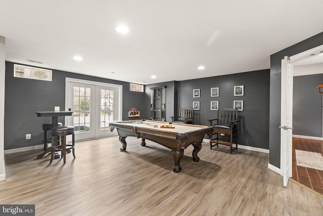 recreation room with light hardwood / wood-style flooring, pool table, and french doors