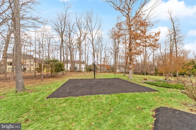 view of yard featuring basketball court