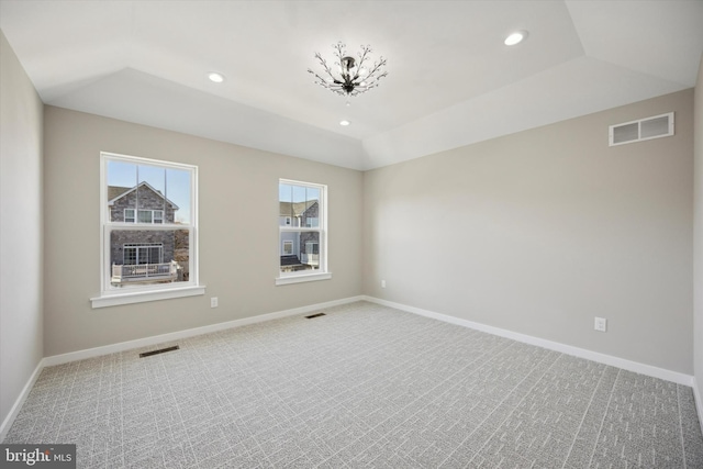 spare room with carpet, visible vents, baseboards, and recessed lighting