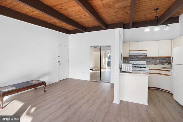 kitchen with white cabinetry, pendant lighting, white appliances, and decorative backsplash