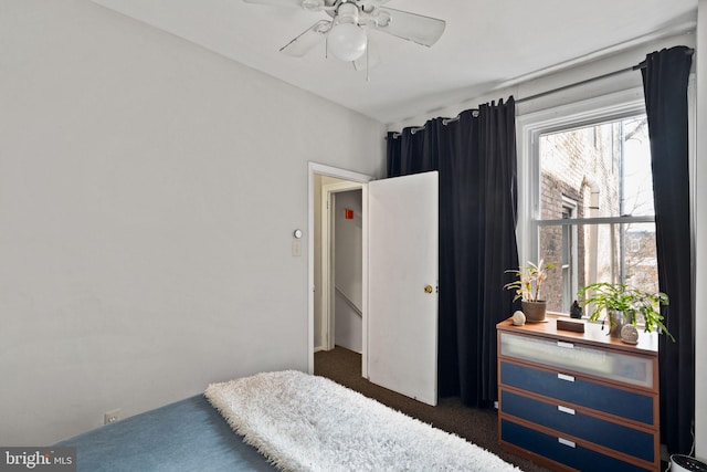 carpeted bedroom featuring ceiling fan