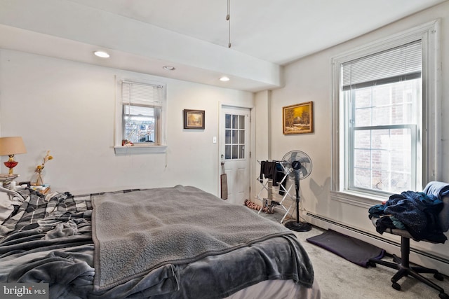 bedroom featuring a baseboard radiator and carpet