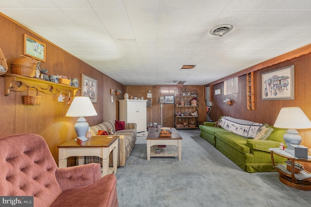 living room with light colored carpet and wooden walls