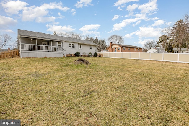 back of property with a lawn