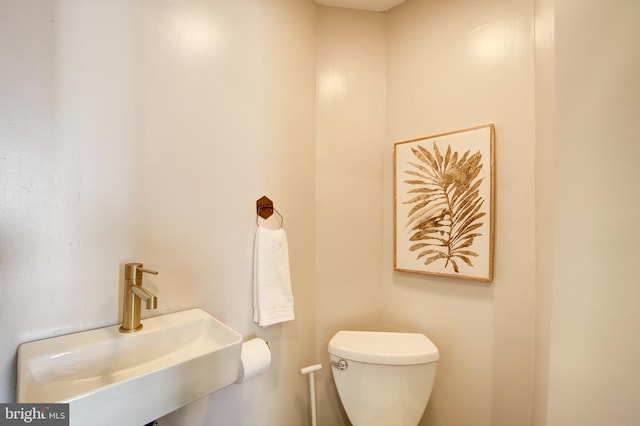 bathroom with a sink and toilet