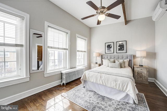 bedroom with dark wood-type flooring, a ceiling fan, baseboards, an AC wall unit, and radiator heating unit