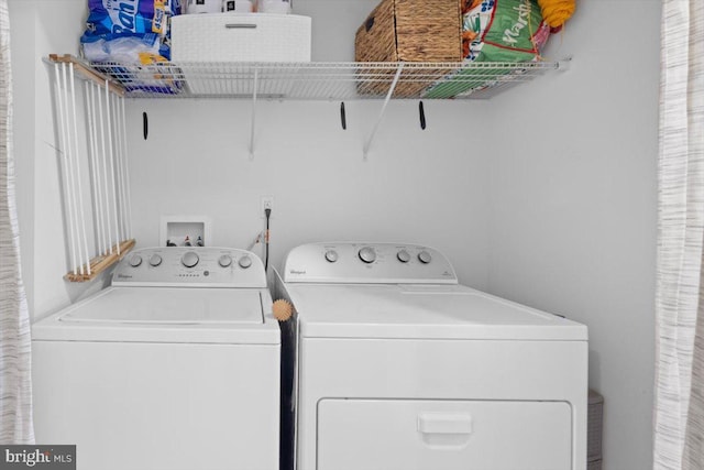 laundry room with washer and clothes dryer