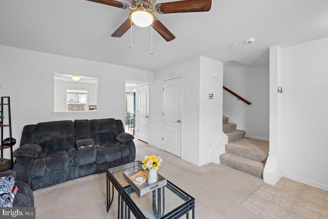 carpeted living room featuring ceiling fan