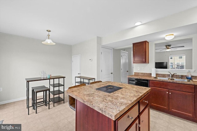 kitchen featuring sink, a center island, black dishwasher, pendant lighting, and ceiling fan