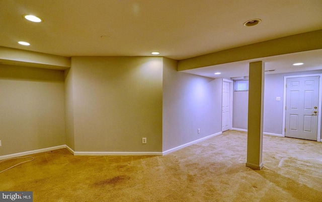 basement with light colored carpet