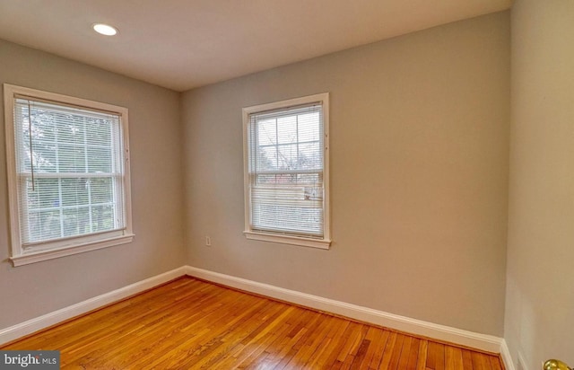 spare room featuring light hardwood / wood-style floors