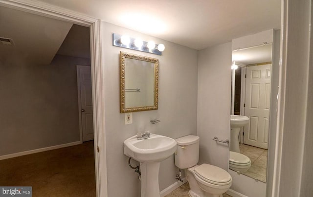 bathroom with sink and toilet