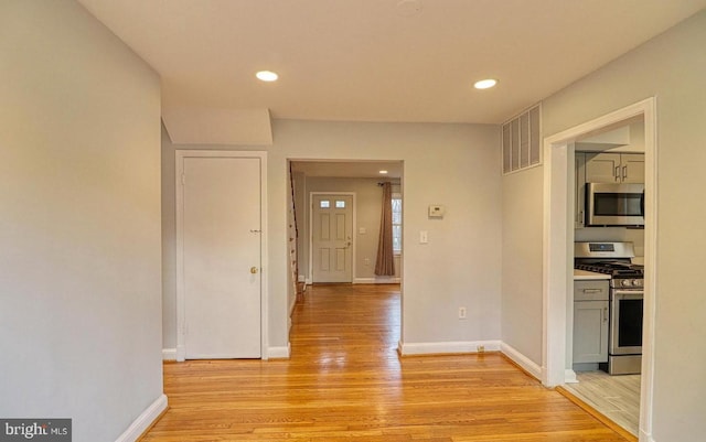 hallway featuring light hardwood / wood-style flooring