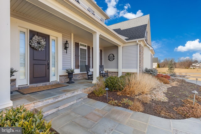 doorway to property with a porch