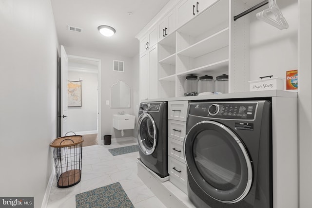 laundry room with washing machine and clothes dryer