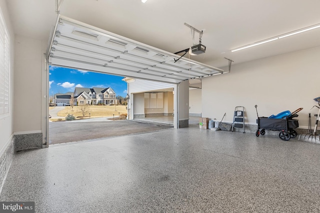 garage featuring a garage door opener