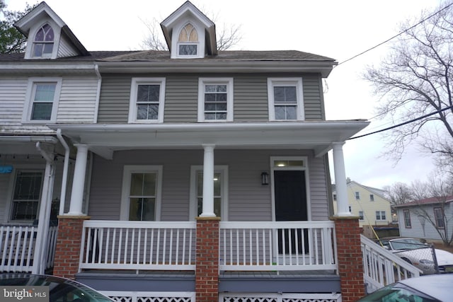 view of property featuring a porch