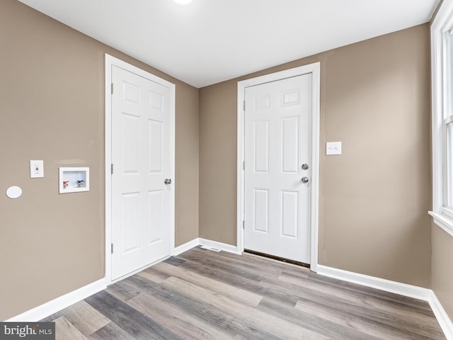 entryway with light hardwood / wood-style floors