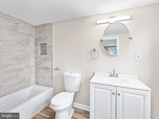 bathroom with vanity, wood-type flooring, and toilet