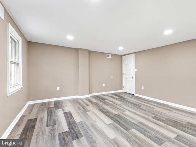 spare room with light wood-type flooring