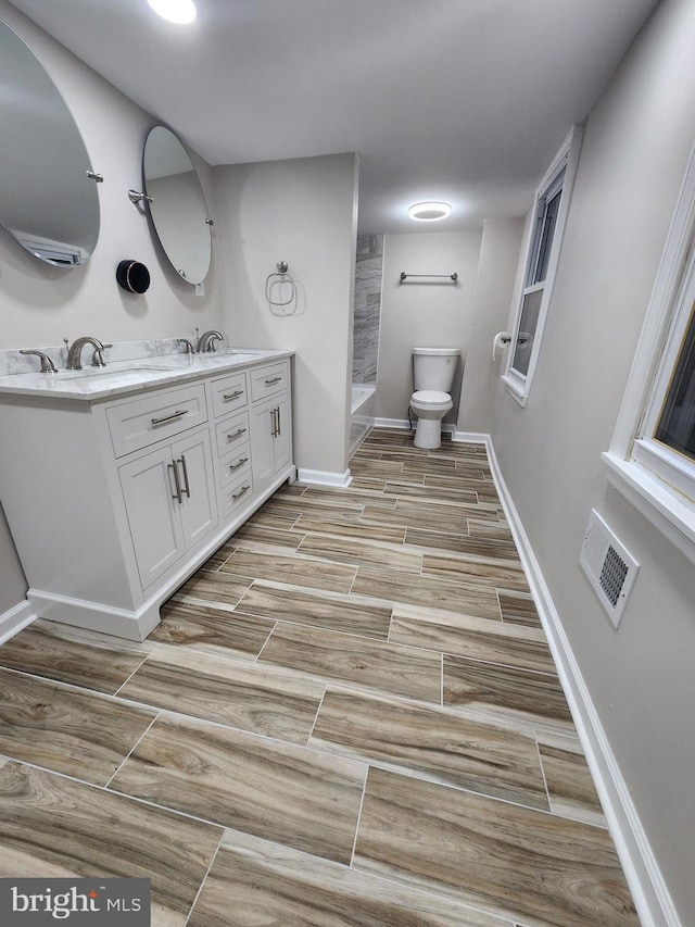 bathroom with vanity and toilet