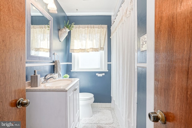 bathroom with toilet, tile patterned flooring, vanity, a shower with curtain, and baseboards