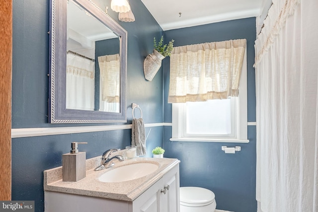 full bathroom featuring toilet and vanity