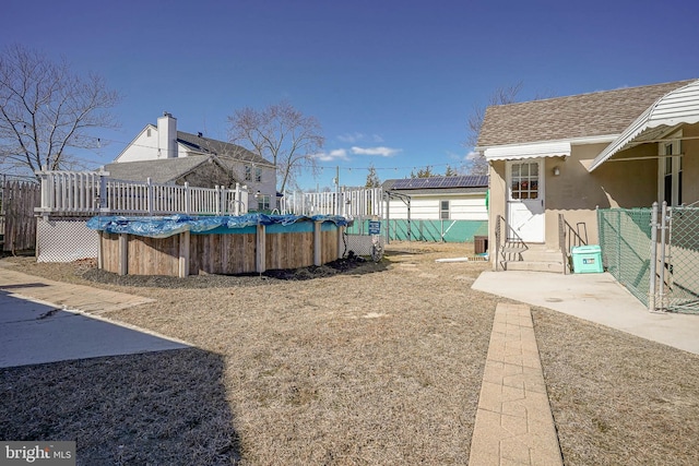 view of yard featuring a fenced in pool and fence