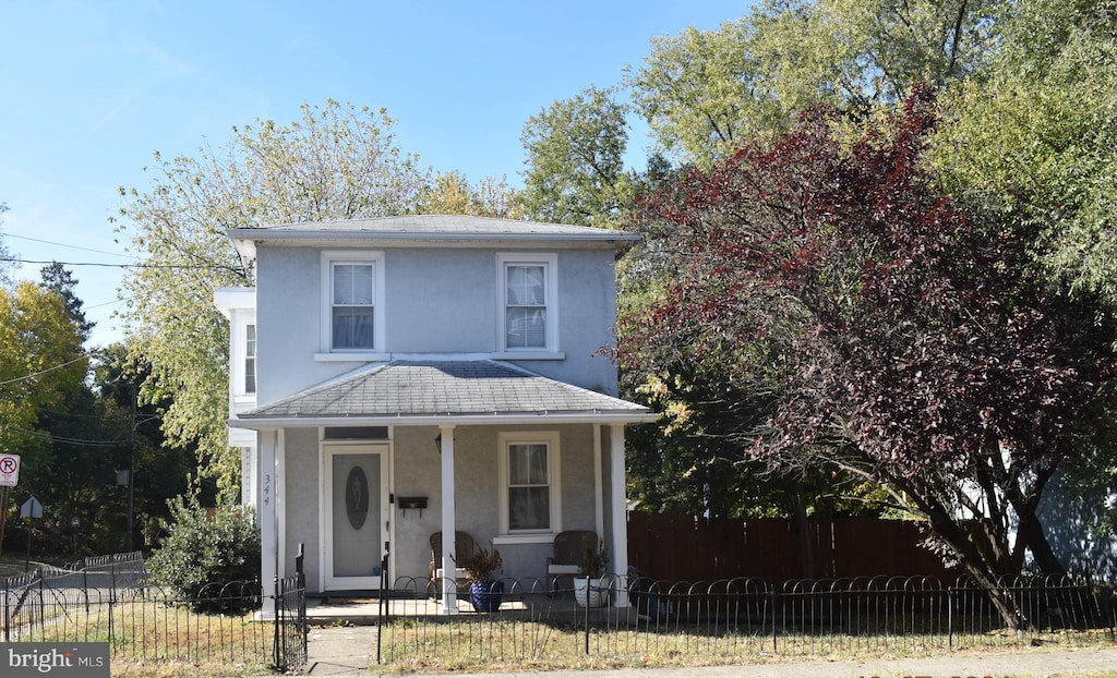 view of property featuring a porch