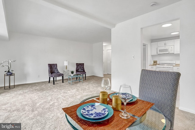 sitting room with light colored carpet