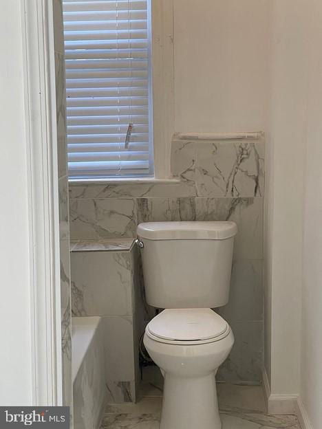 bathroom featuring toilet