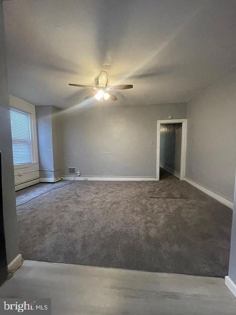 carpeted empty room with ceiling fan