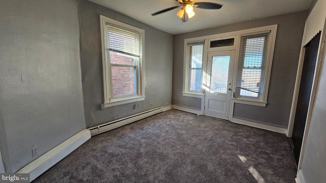 interior space with ceiling fan and a baseboard radiator