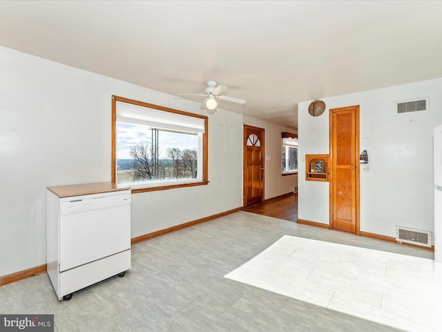 interior space with ceiling fan