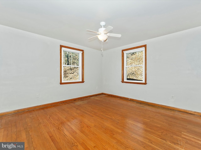 unfurnished room featuring ceiling fan and light hardwood / wood-style flooring