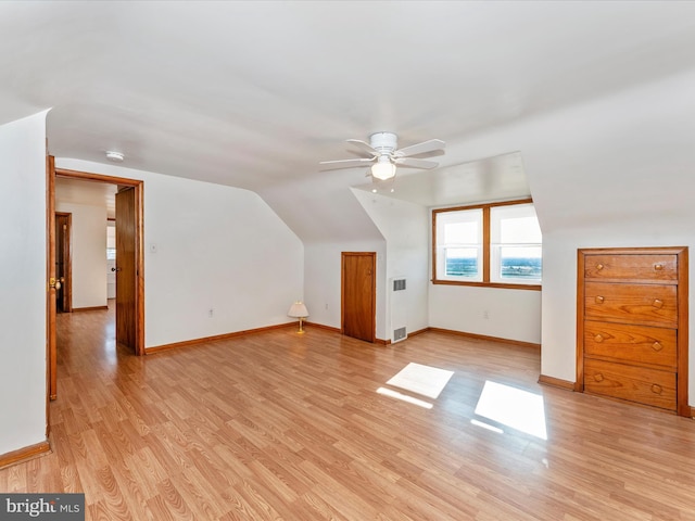 bonus room with ceiling fan, lofted ceiling, and light hardwood / wood-style floors