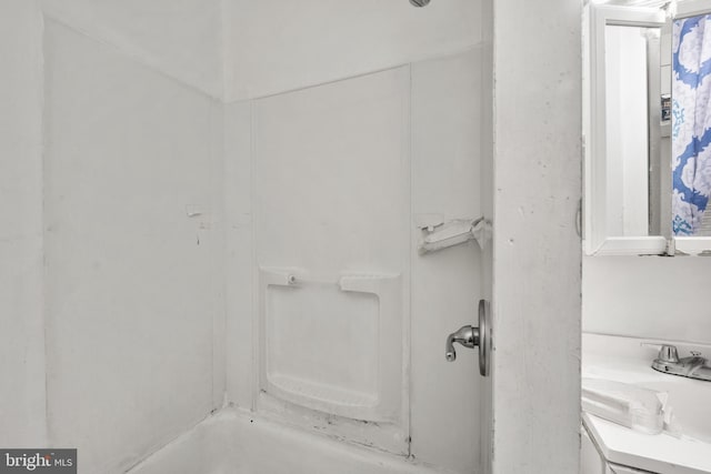 bathroom featuring sink and separate shower and tub