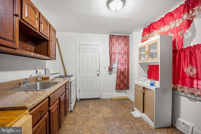 kitchen with sink and white range with gas stovetop