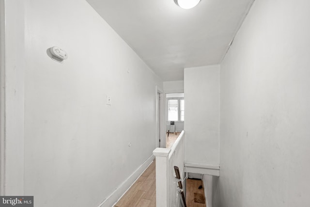 hall with light hardwood / wood-style floors