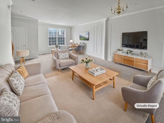 living room featuring a notable chandelier, ornamental molding, baseboards, and light colored carpet