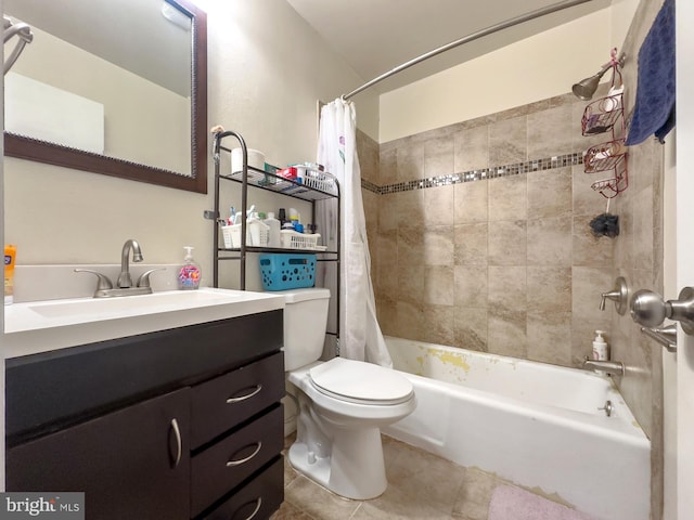 full bathroom with tile patterned floors, toilet, shower / bath combo with shower curtain, and vanity