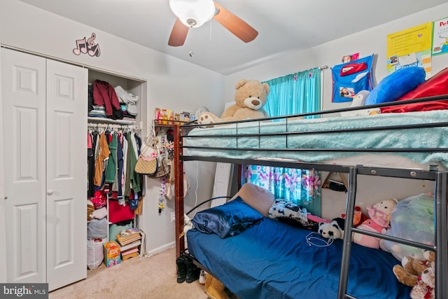 carpeted bedroom with a closet and ceiling fan