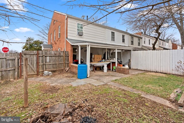 rear view of property featuring a patio