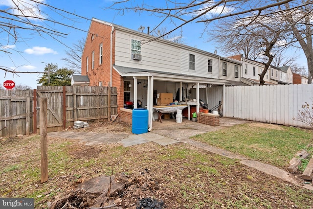 rear view of property featuring a patio