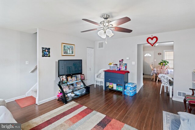 playroom featuring dark wood-type flooring and ceiling fan