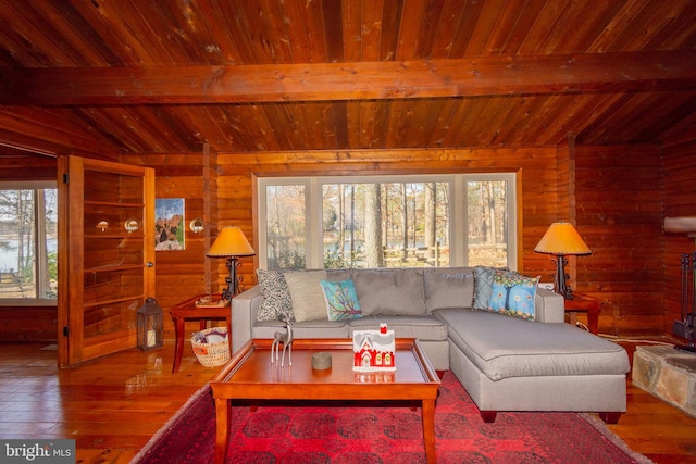 living room with hardwood / wood-style flooring, wood ceiling, wooden walls, and vaulted ceiling with beams